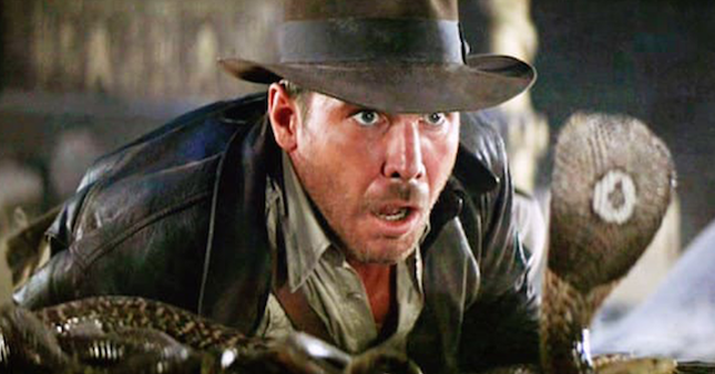 Harrison Ford as Indiana Jones faces a cobra