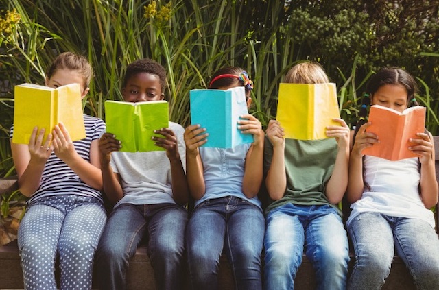 Children reading coloured books