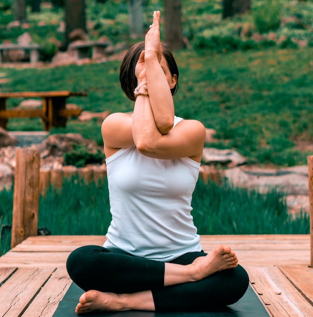 woman holding a yoga pose