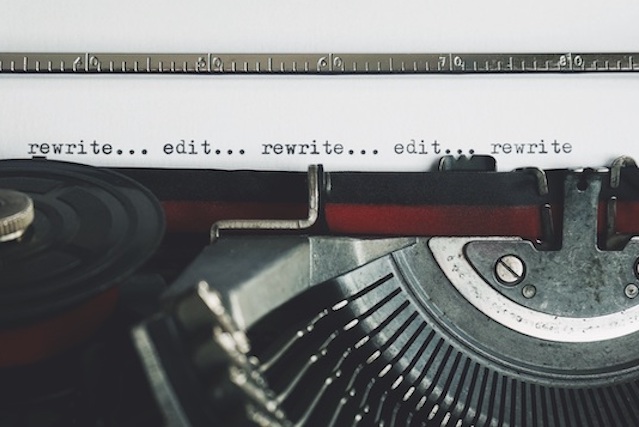 Typewriter page reading: edit...rewrite...edit...rewrite