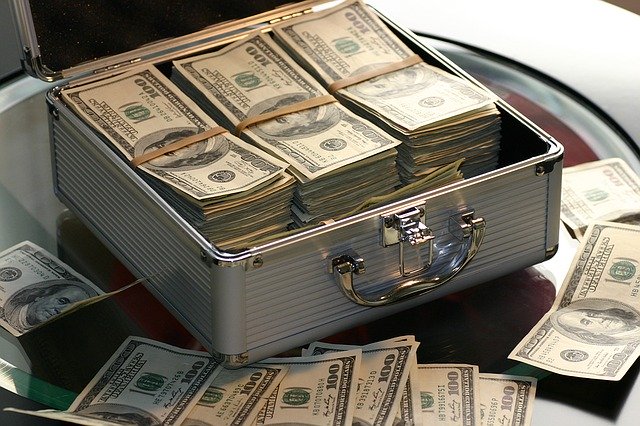 bundles of money in an open briefcase