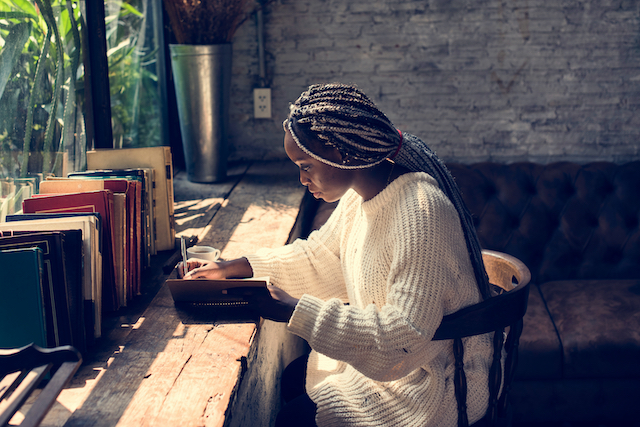 woman writing in notebook