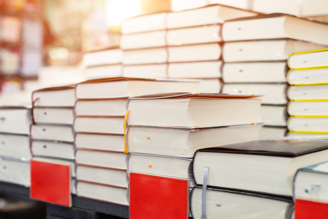 stacks of books on a bookstore table