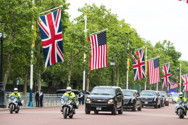 US and UK flags on poles