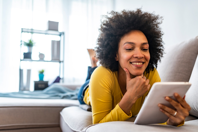 woman reading on a tablet