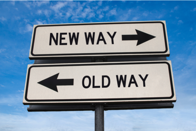 sign pointing right to "New Way", and left to "Old Way"