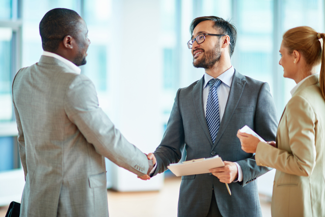 two men shake hands on a deal