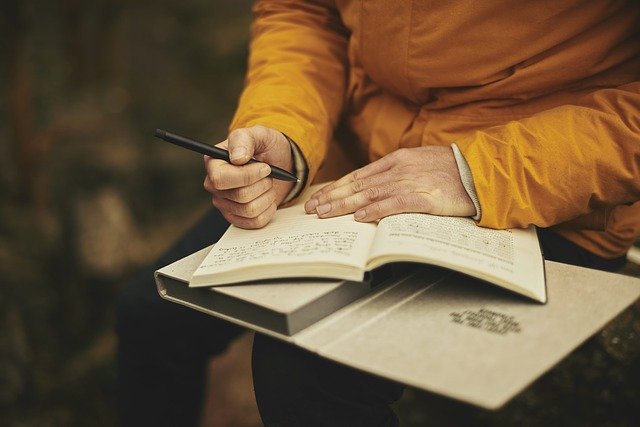 woman writing in journal